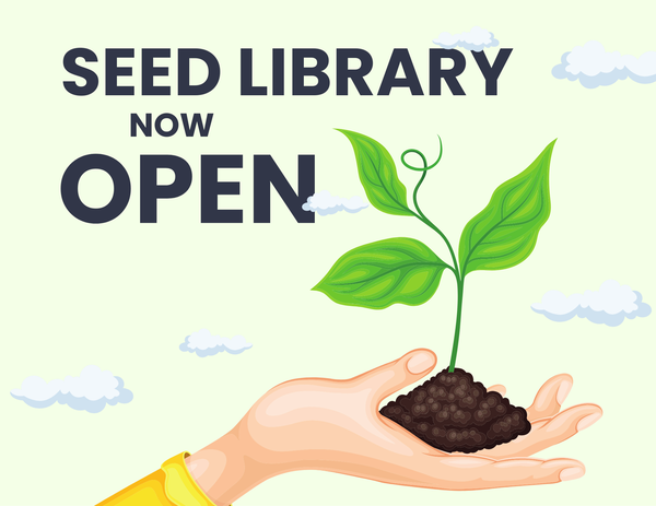seed library open.png Hand holding a seedling with the words Seed Library Now Open